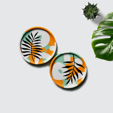 ReStory Eco-resin circular coaster set of 2 - white-orange-green with a leaf pattern