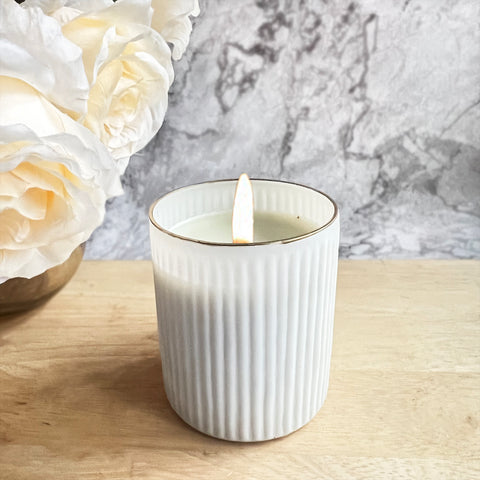 ReStory Scented Candle in white glass jar with gold rim